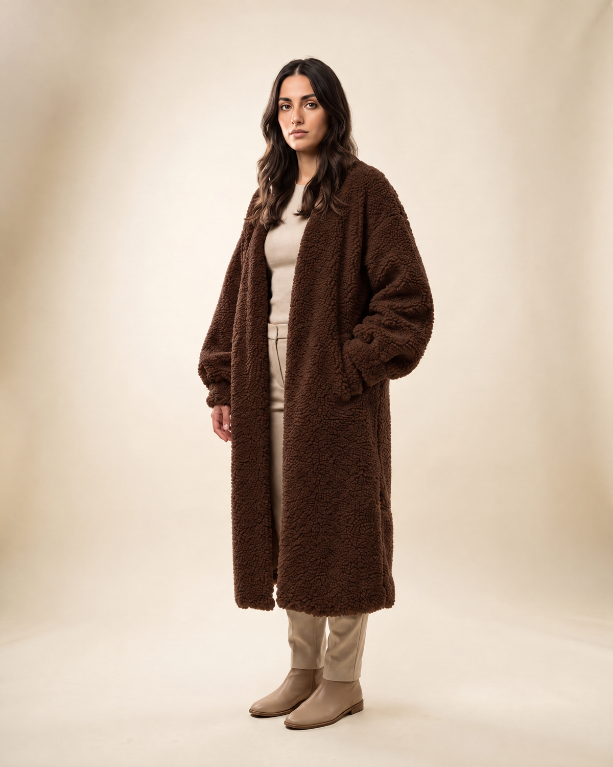 Auria Teddy Coat in chocolate, shown full length on an ivory studio backdrop