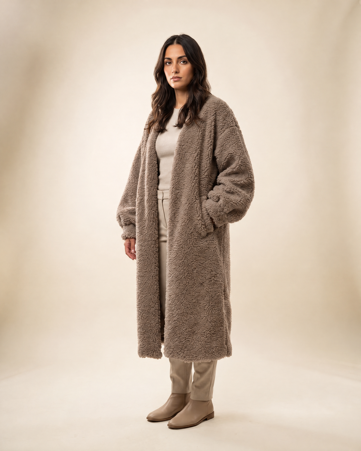 Auria Teddy Coat in taupe, shown full length on an ivory studio backdrop
