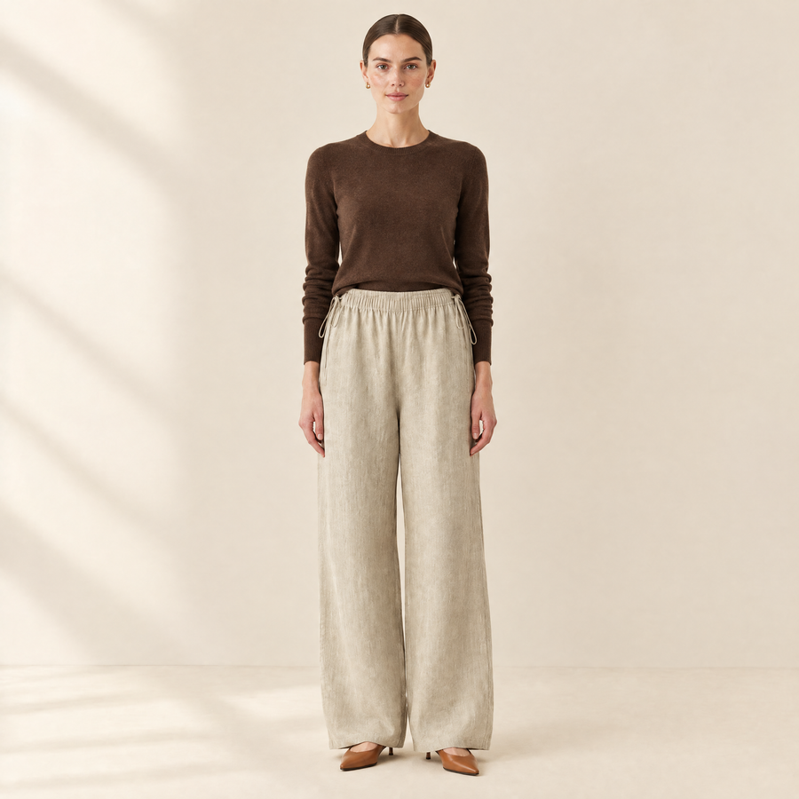 Lucia Linen-Blend Wide-Leg Trousers in sand, styled with a brown knit