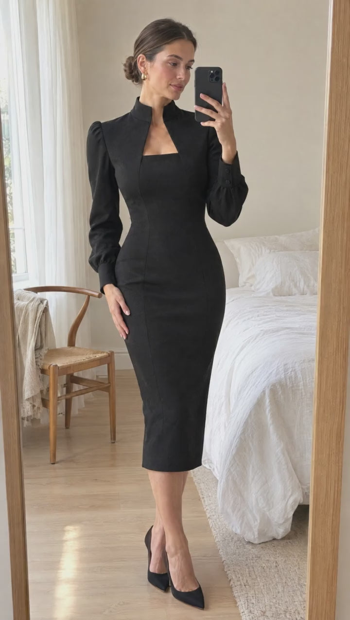 Mirror try-on of the Thea Midi Dress in black, turning to show the side profile